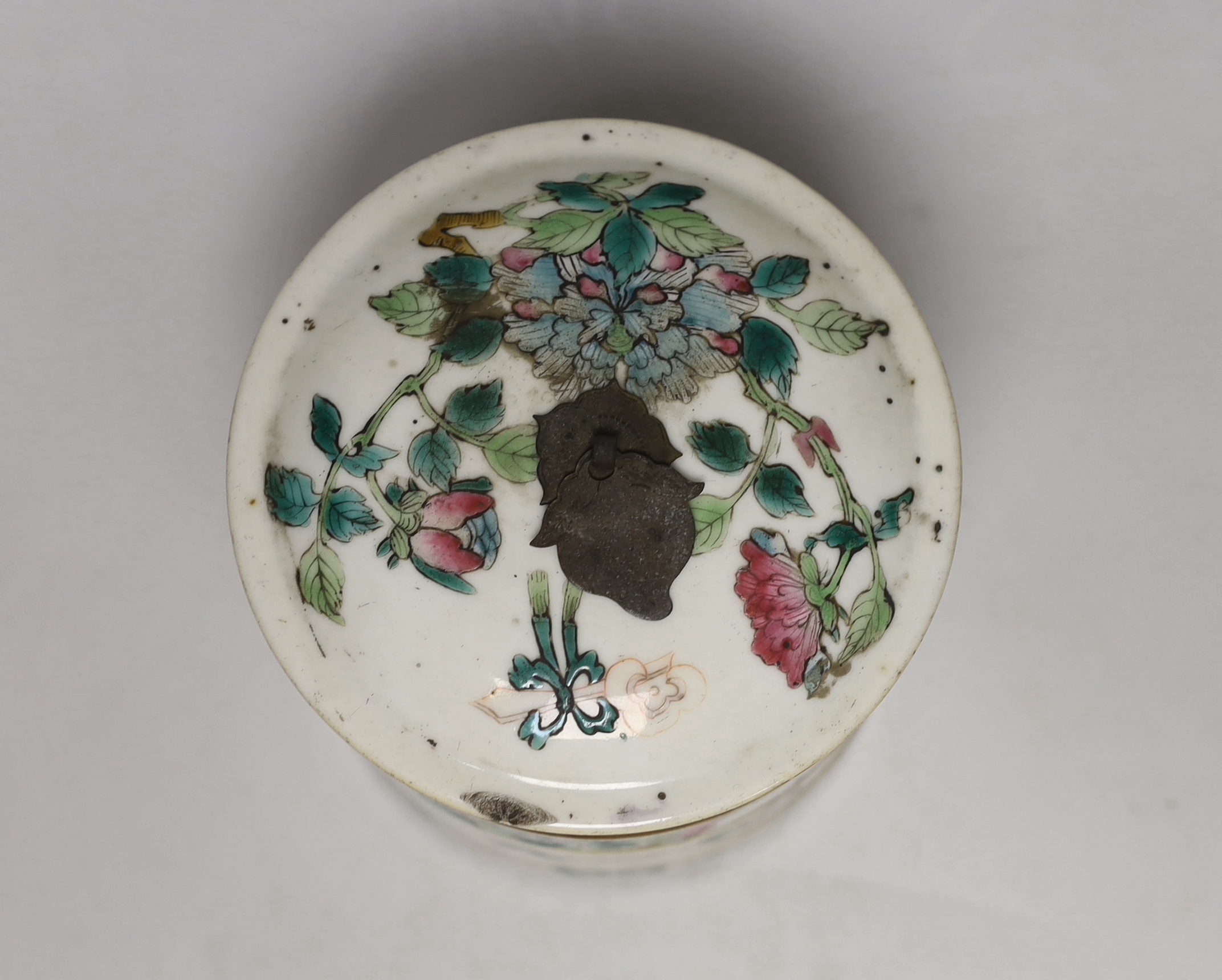 An early 20th century Chinese enamelled porcelain four section stacking food container, with cover 13cm high